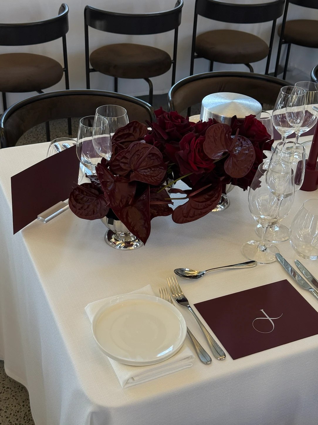Place setting with burgundy anthurium
