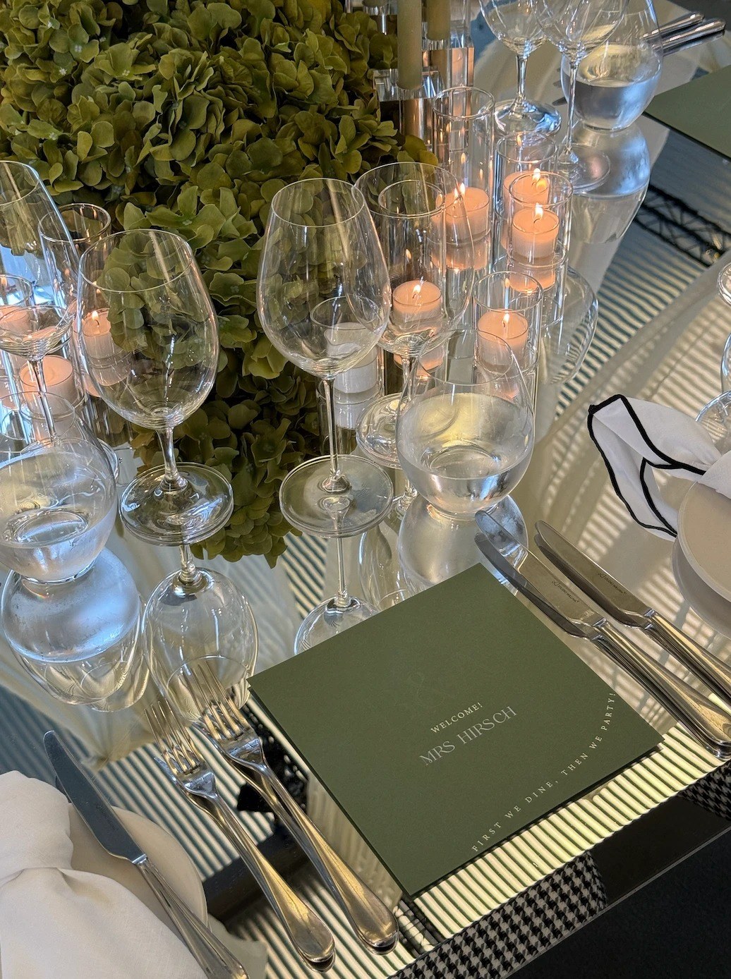 Green welcome menu and place setting